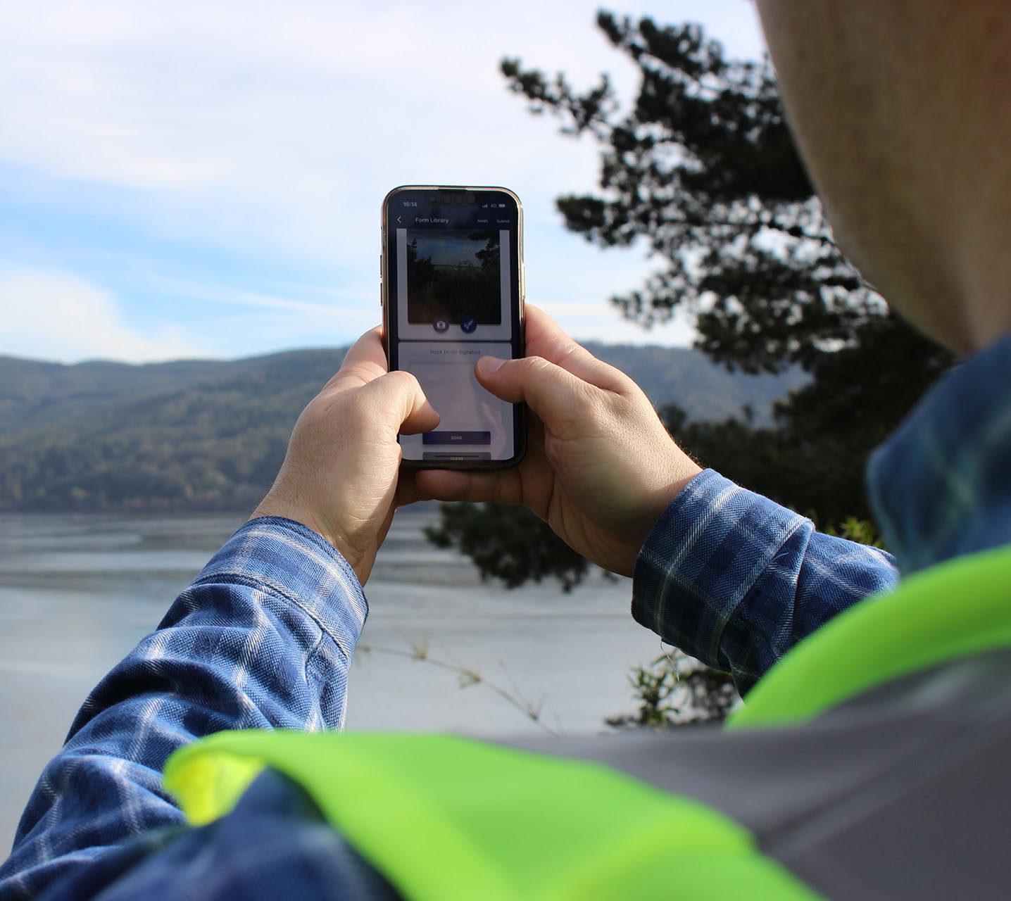 Field worker using mobile phone.