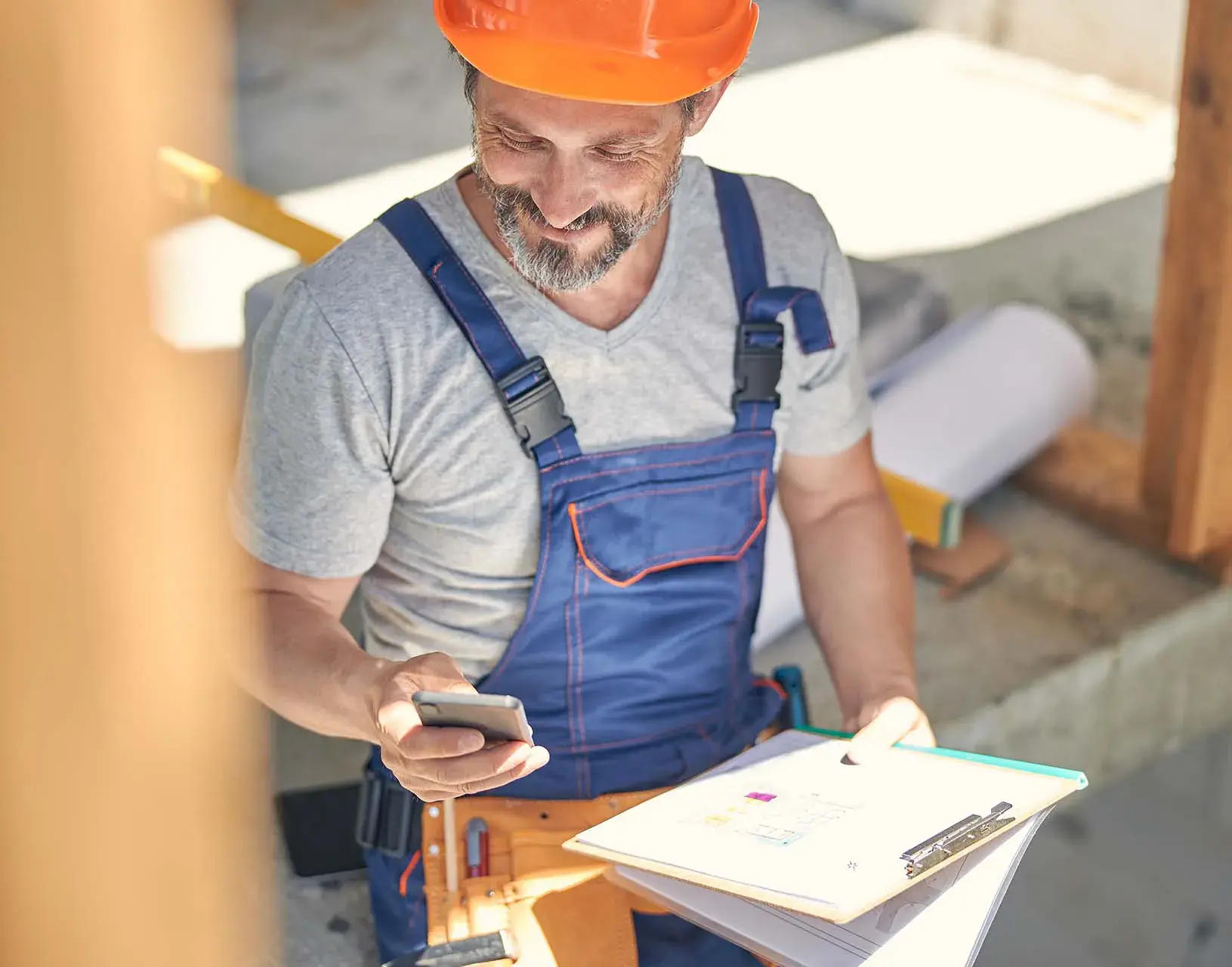 construction worker using mobile phone