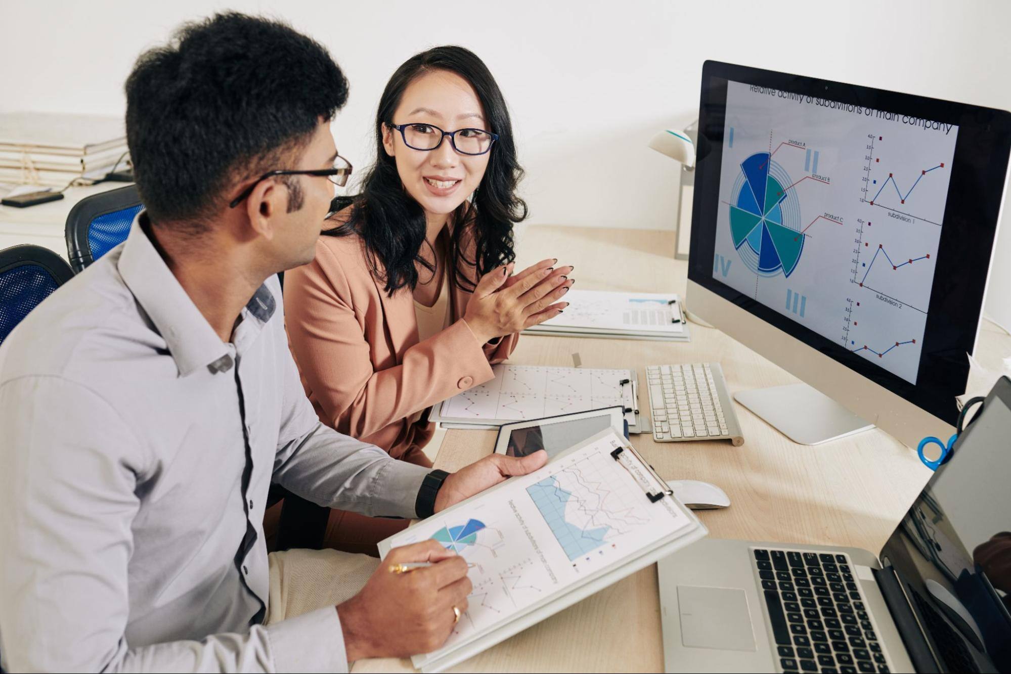 Two entrepreneurs discussing and analyzing the data.